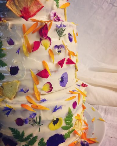 A cake is transformed by adorable edible flowers.